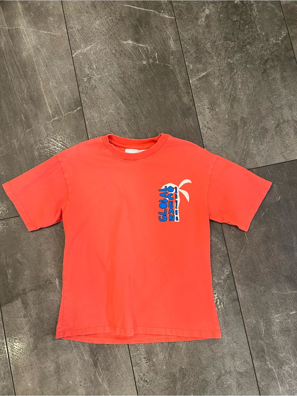 Zara orange cotton t-shirt with palm tree graphic. Size: 9 years